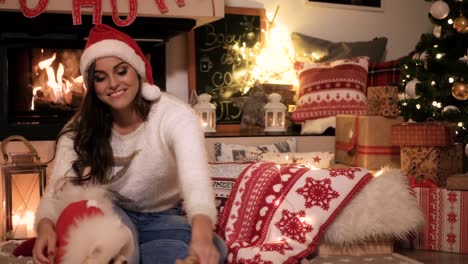 Woman-playing-with-playful-dog-at-home