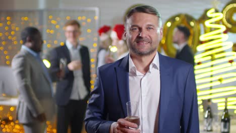 Businessman-Posing-at-New-Year-Party-in-Office