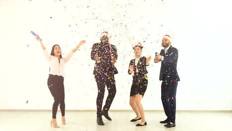 The-four-business-people-playing-with-confetti.-slow-motion