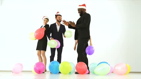 The-four-business-people-dancing-with-balloons.-slow-motion