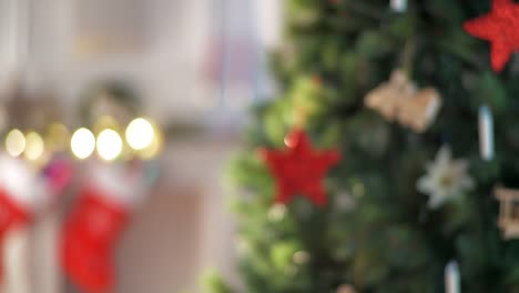 happy-stylish-woman-with-yellow-piggybank-near-Christmas-tree