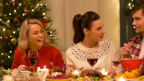 friends-eating-at-home-christmas-dinner-party