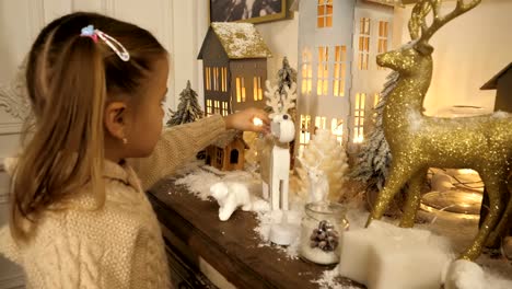 Cute-little-girl-looking-at-christmas-decorations