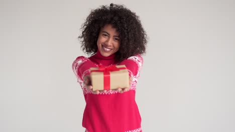 Happy-woman-holding-Christmas-gift-box