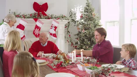 Grandmother-Brings-Out-Turkey-At-Christmas-Meal-Shot-On-R3D