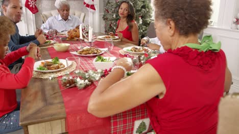 Family-With-Grandparents-Enjoying-Christmas-Meal-Shot-On-R3D