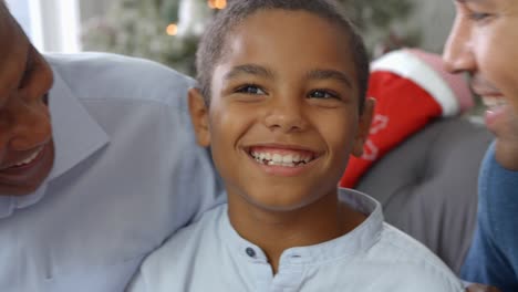 Close-Up-Of-Boy-With-Grandfather-And-Father-At-Christmas