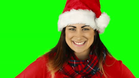 Festliche-brunette-in-Weihnachtsmütze-Blasen-über-die-Hände