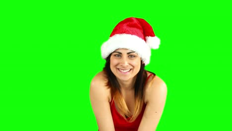 Pretty-girl-in-santa-hat-enviando-un-beso-de-aire