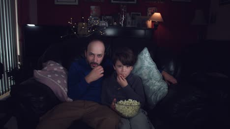 4k-Authentic-Shot-of-a-Child-watching-Football-with-his-Dad