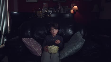 4k-Authentic-Shot-of-a-Funny-Child-Watching-Horror-Movie-with-Popcorn