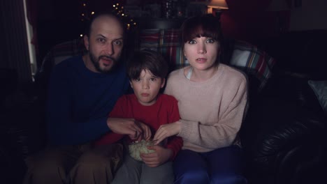 4k-Authentic-Shot-of-a-Funny-Family-Watching-Horror-Movie-with-Popcorn