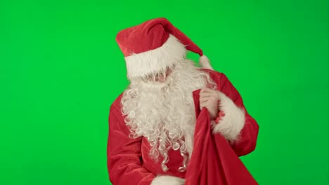 Santa-Claus-Packaging-Gifts-on-a-Green-Screen-Chrome-Key