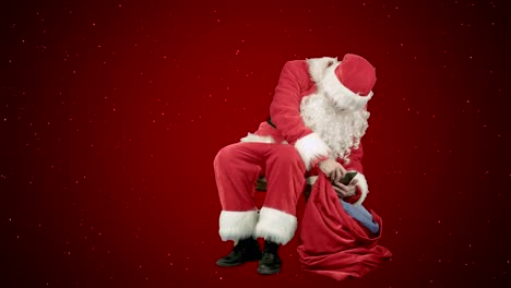Weihnachtsmann-auf-dem-Tablet-im-neuen-Jahr-auf-rotem-Hintergrund-mit-Schnee
