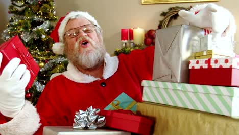 Santa-claus-holding-various-gift-boxes