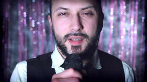 4K-Disco-Christmas-Shot-of-a-Man-singing-at-Microphone