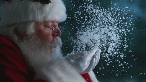 Santa-Claus-blowing-snow-from-hands-in-slow-motion