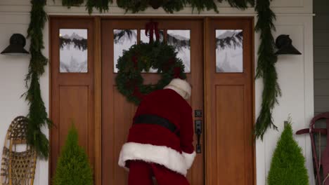 Santa-Claus-going-into-front-door-of-home