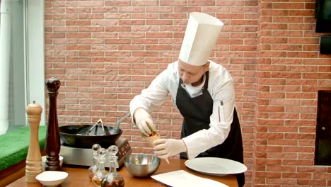 Chef-putting-fresh-salad-to-a-corn