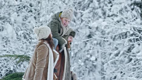 Family-Carrying-Christmas-Tree-and-Laughing