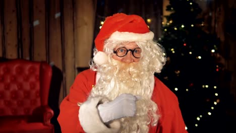 Santa-Claus-dancing-near-fireplace-at-Christmas-night.