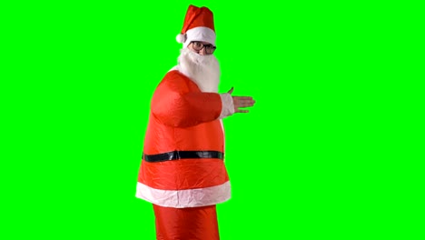 Santa-Claus-makes-robot-moves-with-his-hands-on-green-background.