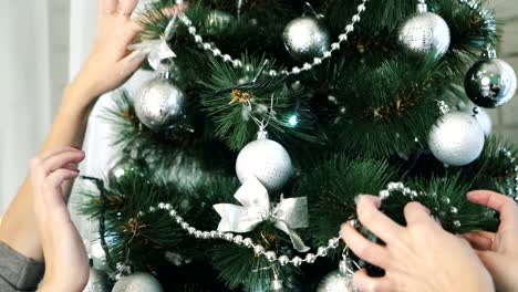 Women-sitting-near-Christmas-tree