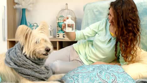 Girl-showing-dog-Christmas-toys