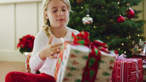 Young-Girl-Opening-Christmas-Presents