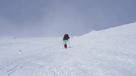 Girl-hiking-on-snow-in-Slovak-mountains-during-sunny-day-in-winter