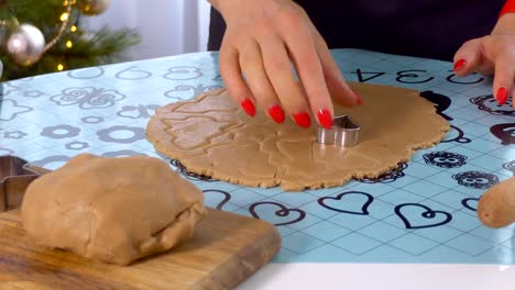 Woman-make-ginger-bread-for-Christmas.-Close-up