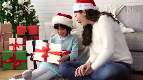 mother-gives-her-little-daughter-presents