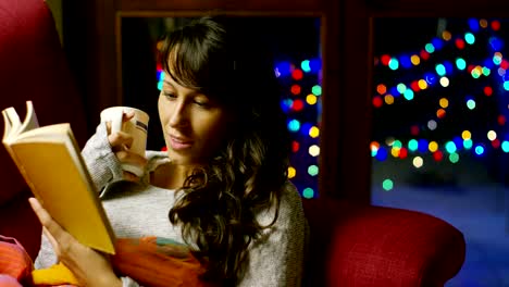 Girl-with-Christmas-hat-makes-wishes-and-opens-a-Christmas-gift-package.-concept-of-holidays-and-new-year.-the-girl-is-happy-and-smiles-with-christmas-gift-in-hand.