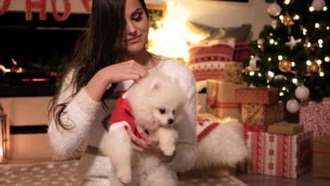 Woman-and-dog-having-a-fun-at-christmas