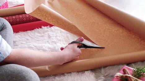 Woman-preparing-christmas-presents-at-home