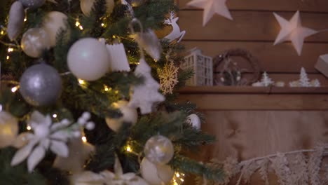 A-little-boy-decorates-a-Christmas-tree-with-a-beautiful-ball.