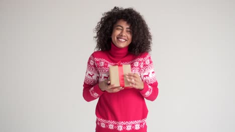 Happy-woman-holding-Christmas-gift-box