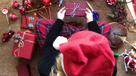 Woman-holding-Present-and-Christmas-Flat-Lay