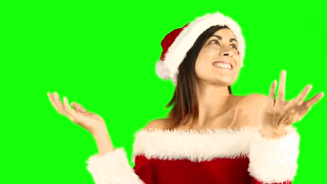 Joyful-santa-girl-looking-up-and-smiling-at-camera