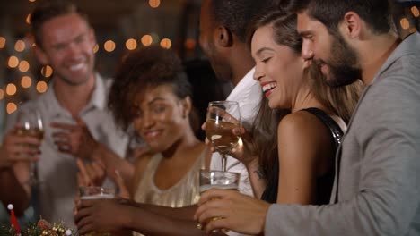 Friends-dancing-by-the-bar-at-a-Christmas-party