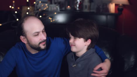 4k-Authentic-Shot-of-a-Child-Hugging-and-Smiling-with-his-Dad