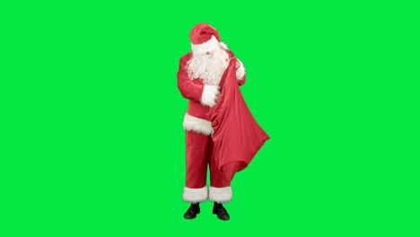 Echter-Weihnachtsmann-trägt-große-Tasche-voller-Geschenke-auf-einem-Green-Screen-Chrome-Key