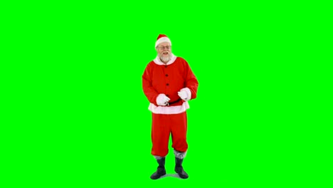 Santa-claus-dancing-against-green-background