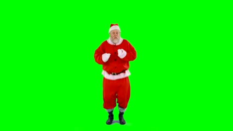 Santa-claus-dancing-against-green-background