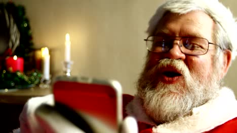 Santa-claus-using-mobile-phone