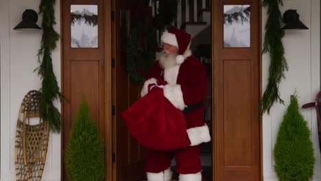 Santa-Claus-coming-out-of-house