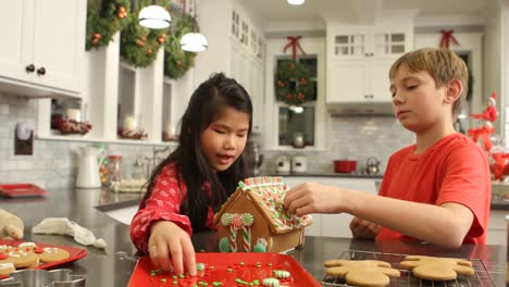 Decorating-gingerbread-house-for-Christmas