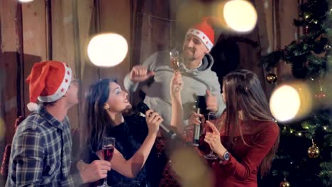 Joyfull-friends-dancing-having-fun-at-glamorous-New-year-christmas-party-celebrating-holidays.-4K.