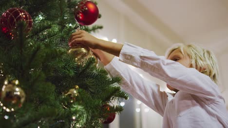 Young-Boy-Decorating-Christmas-Tree