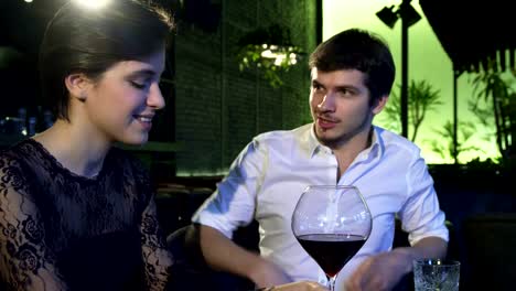 Loving-couple-talking-joyfully-while-on-a-date-at-the-restaurant